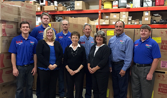 sr-group.warehouse S&R Heating & Cooling team in company warehouse